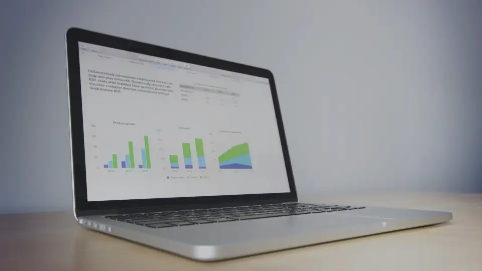 A laptop showing charts