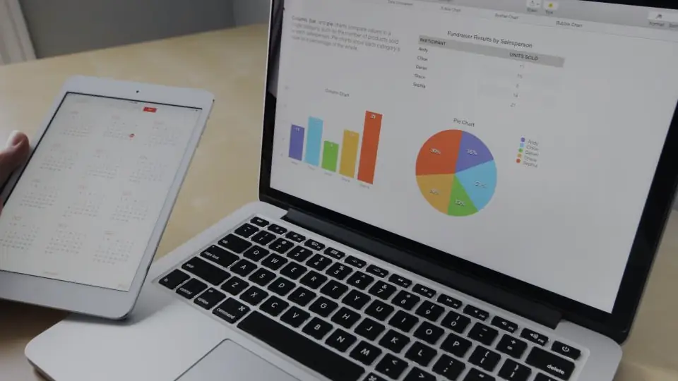 A laptop and tablet showing dashboards